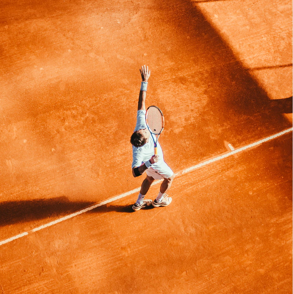 Tennis player serves
